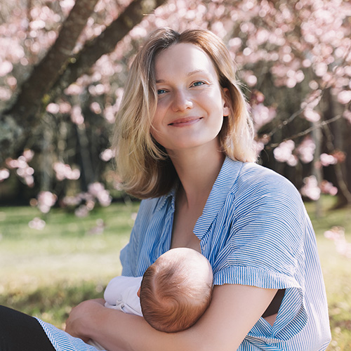image of lady breast feeding baby